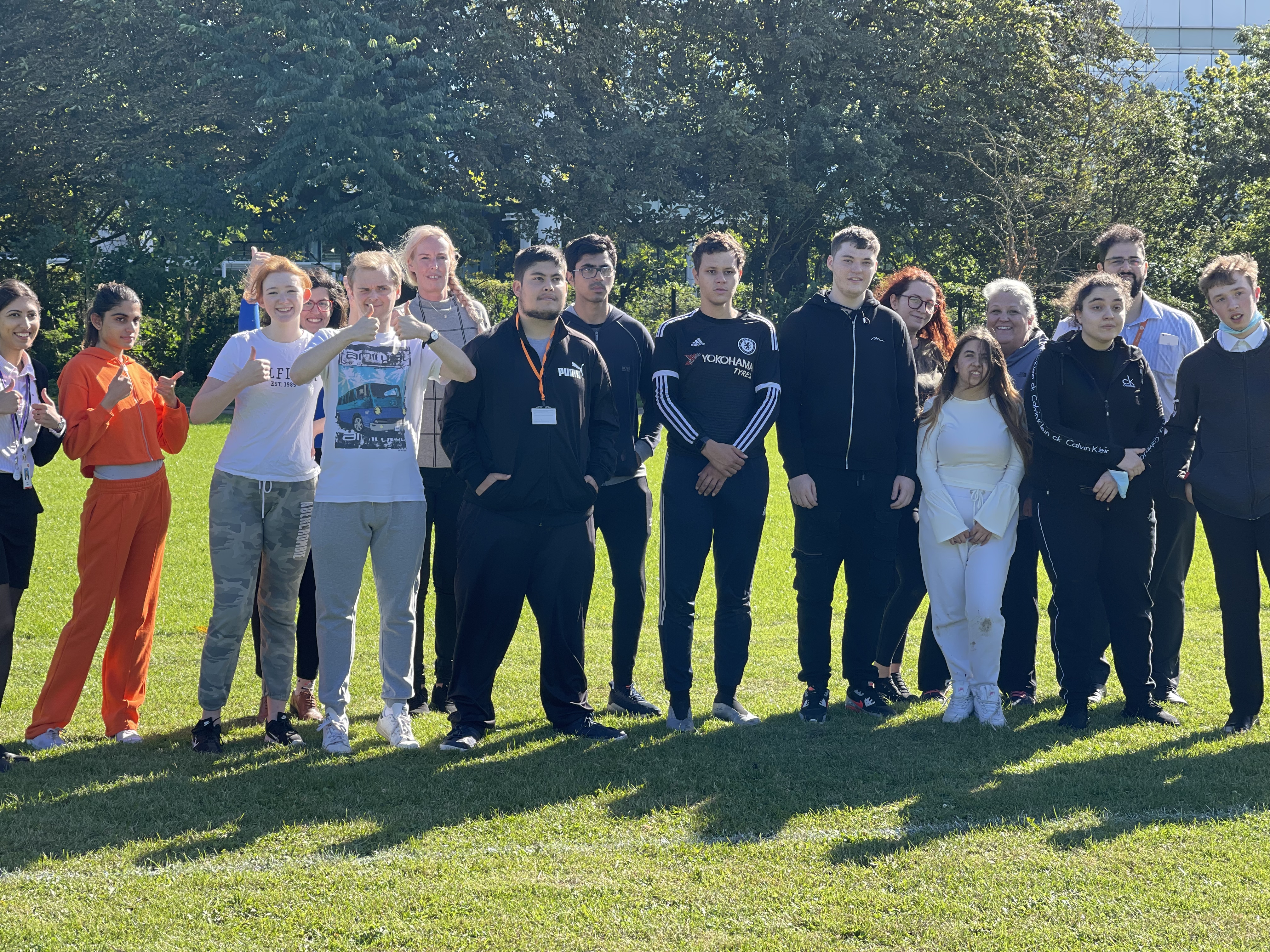 a group of happy project search students standing together in the sun