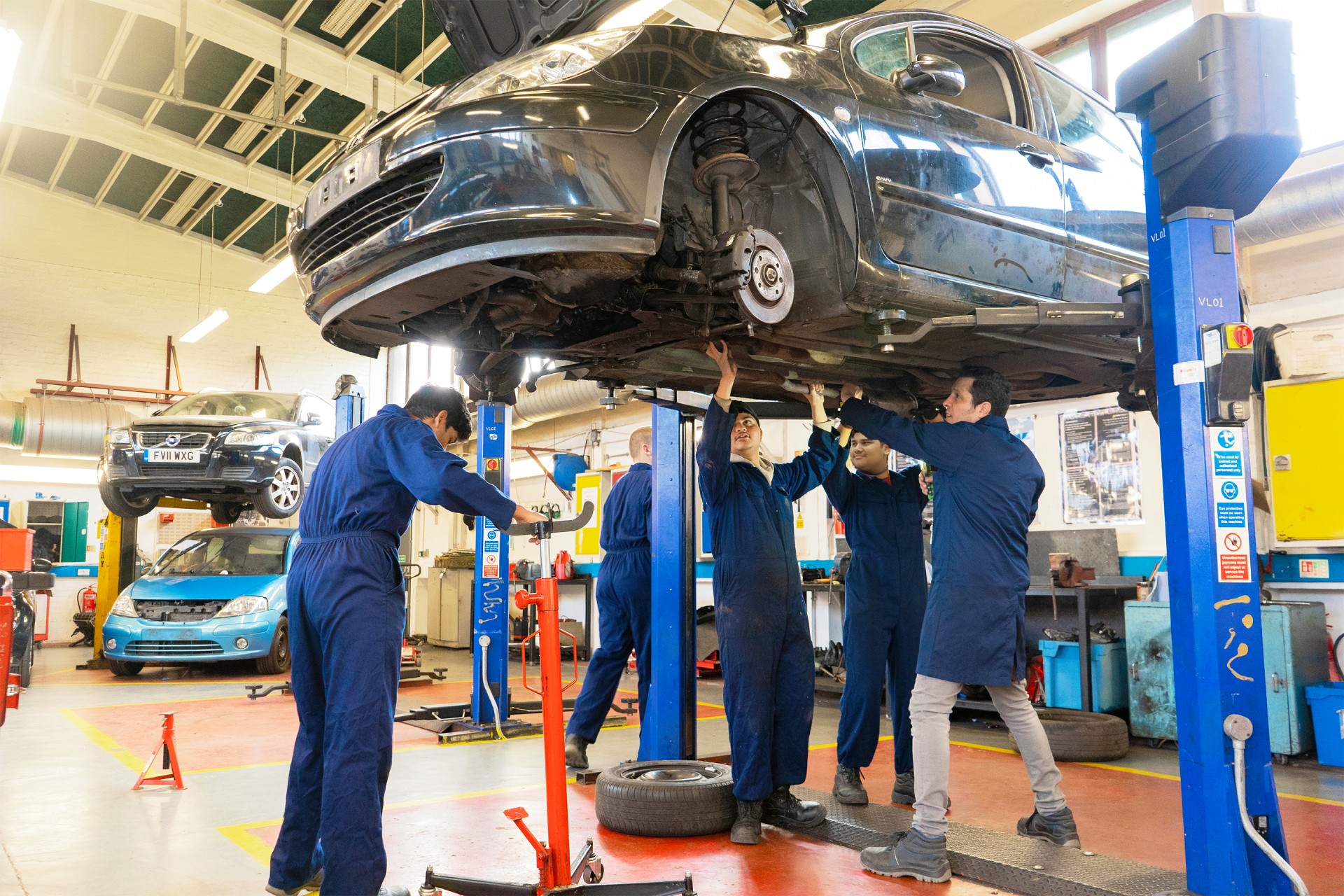 Group working on a car